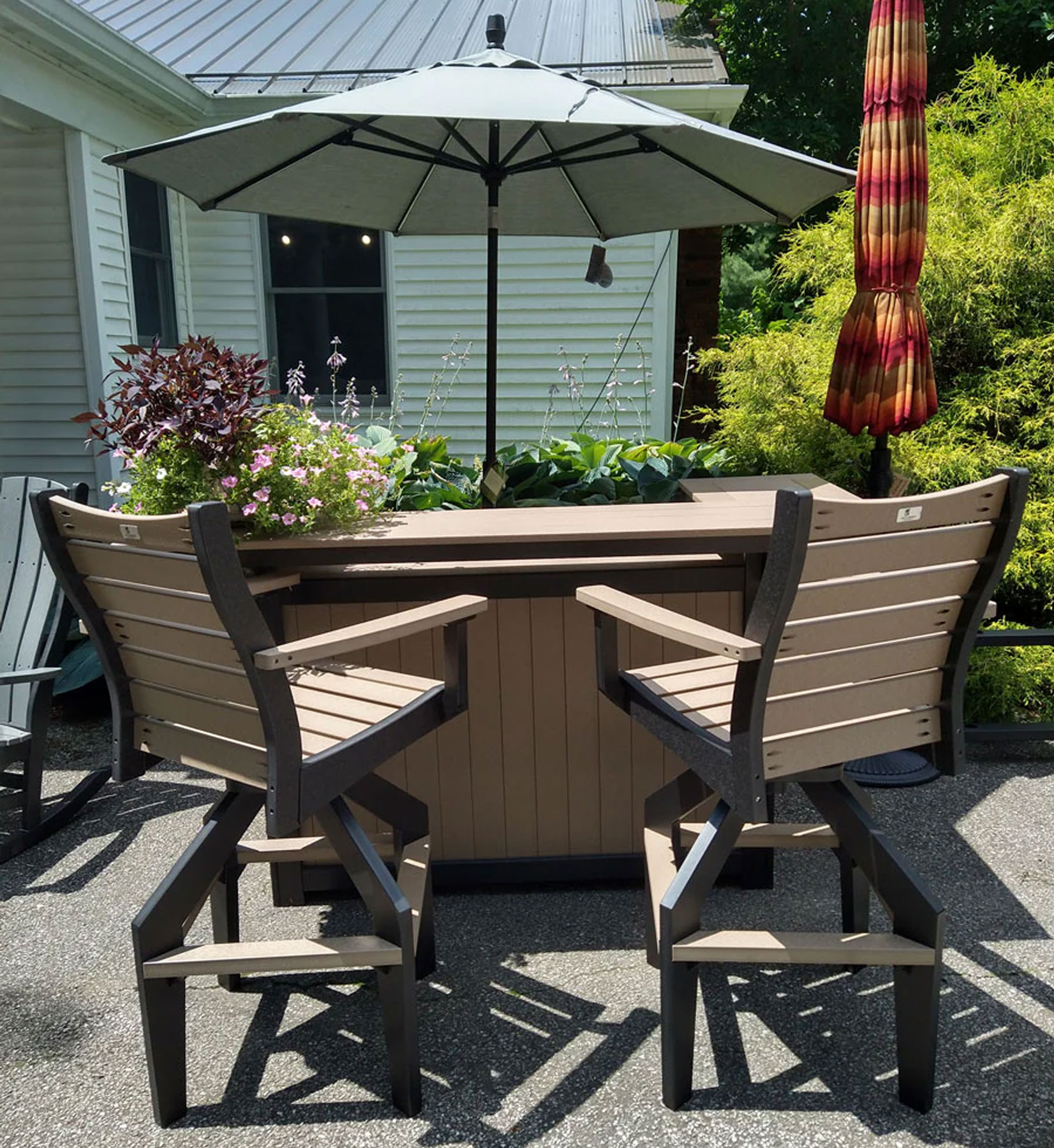Outdoor Island with (2) Bristol XT Swivel Chairs in Weatherwood on Black